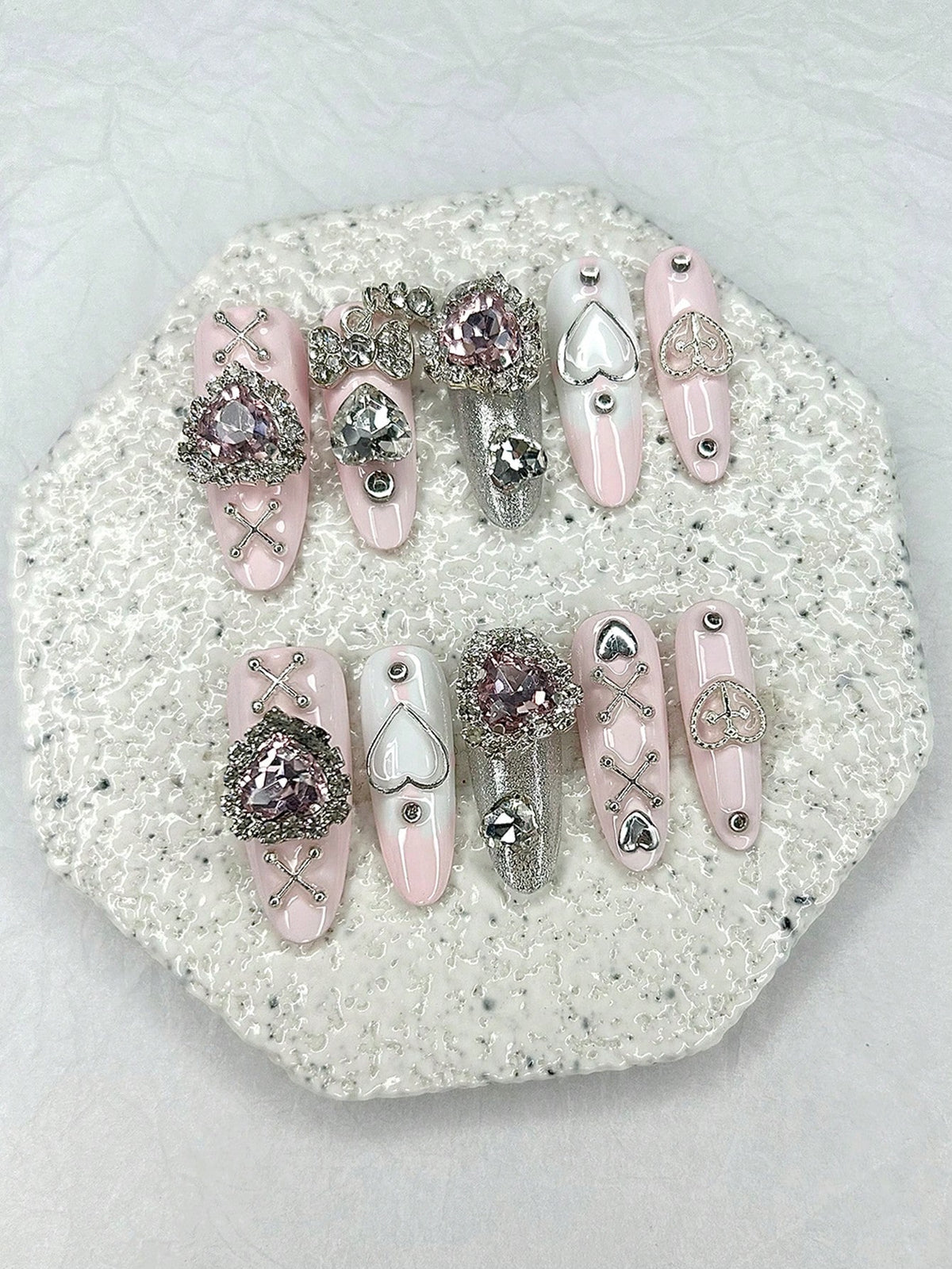 Crystal heart and silver cross-lace oval press-on nails, detail view