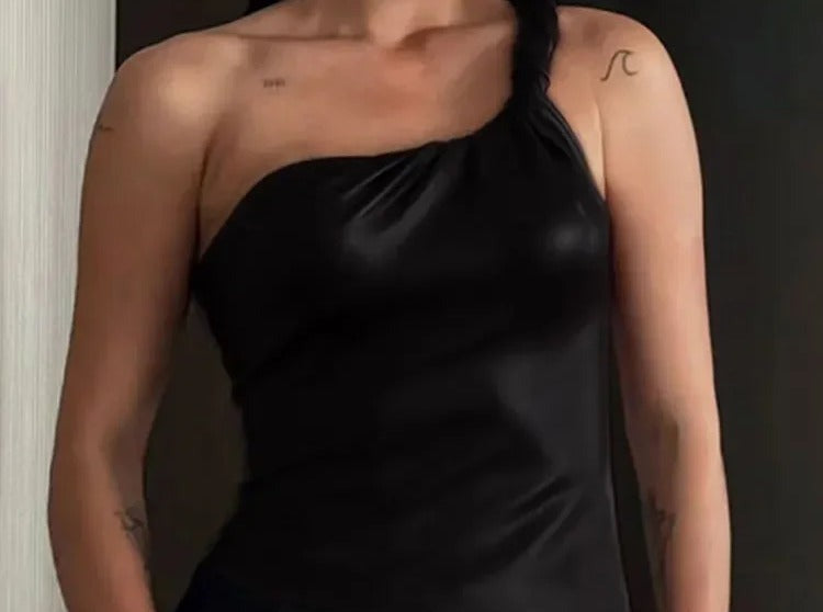 Black satin one shoulder top with gathered draping across the bust