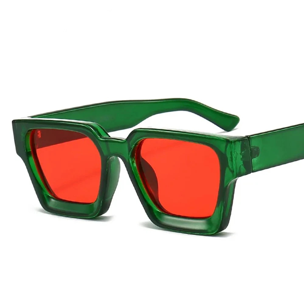 Chunky square sunglasses with a green frame and red tinted lenses, front view