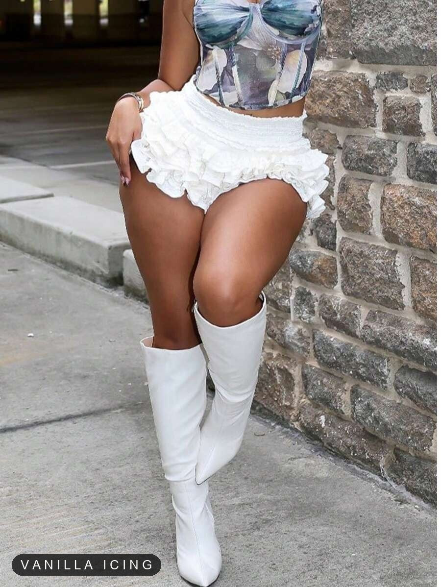 Vanilla Icing ruffle skort styled with tall white boots