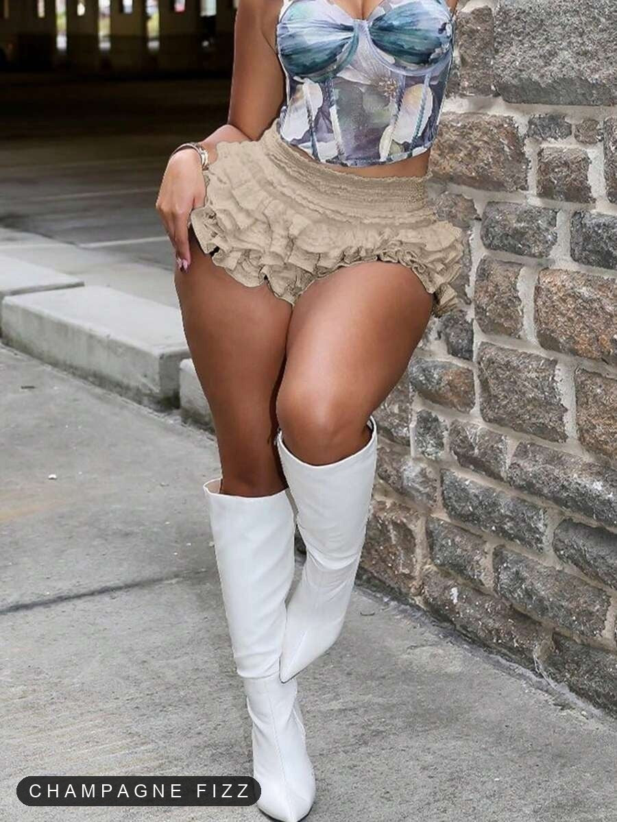 Champagne Fizz ruffle skort styled with white boots