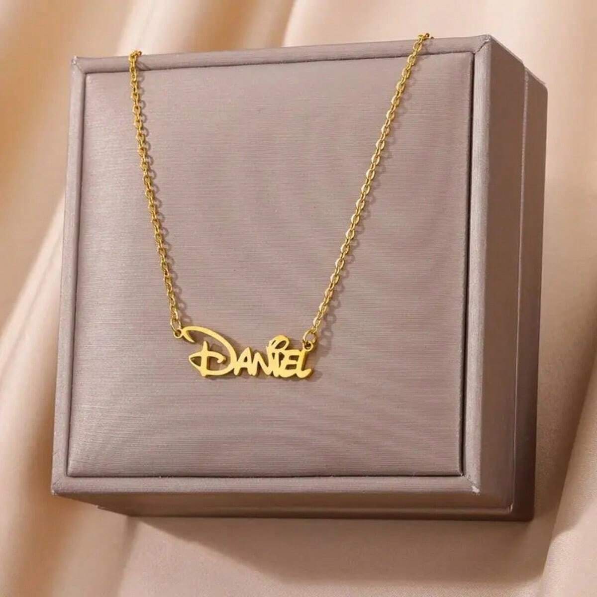 Personalized name necklace presented in a gift box