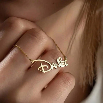 Personalized gold nameplate necklace worn on the collarbone