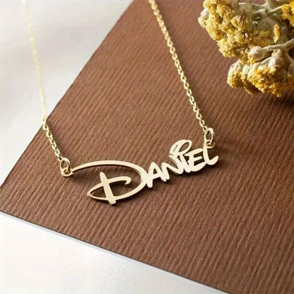 Gold nameplate necklace styled flat lay