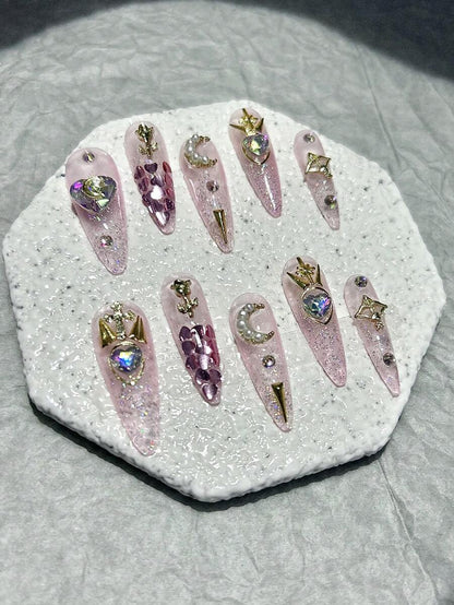 Close detail of the pearl crescent moon and heart gem nails