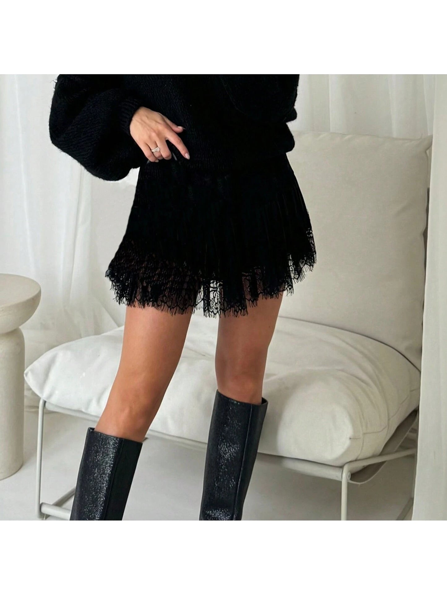 Black lace mini skirt with tall boots