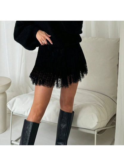 Black lace mini skirt with tall boots