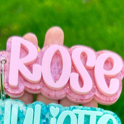 Pink glitter personalized name keychain close up