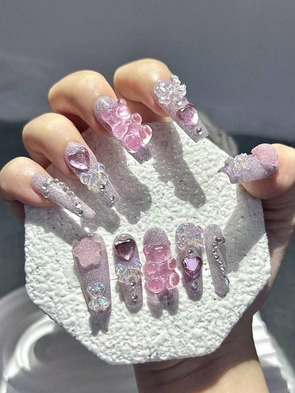 Strawberry Milk Bear press on nails worn on hand
