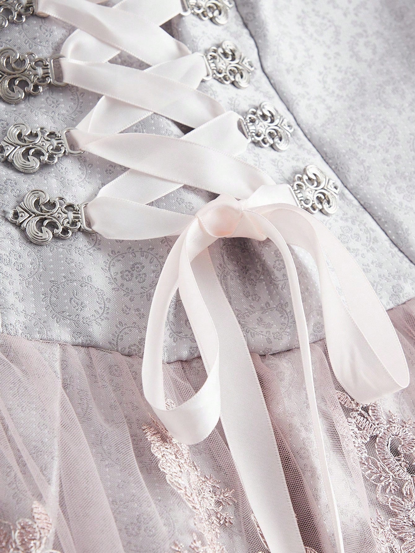 Lace-up eyelet and ribbon detail