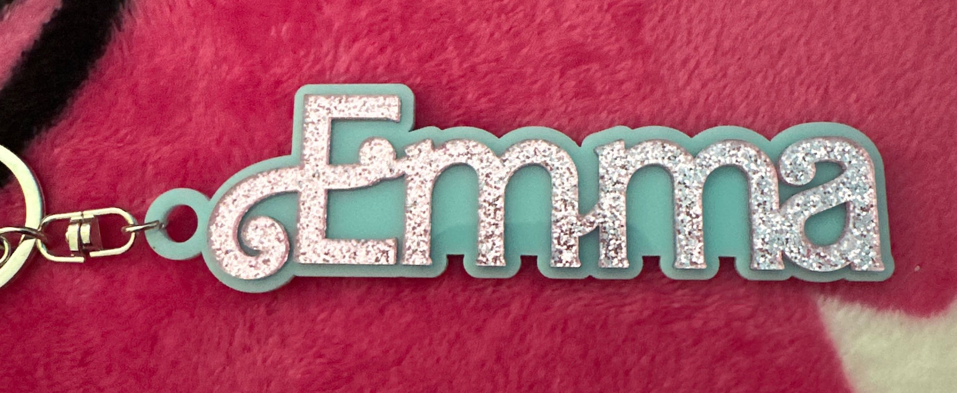 Customer photo - cyan name charm