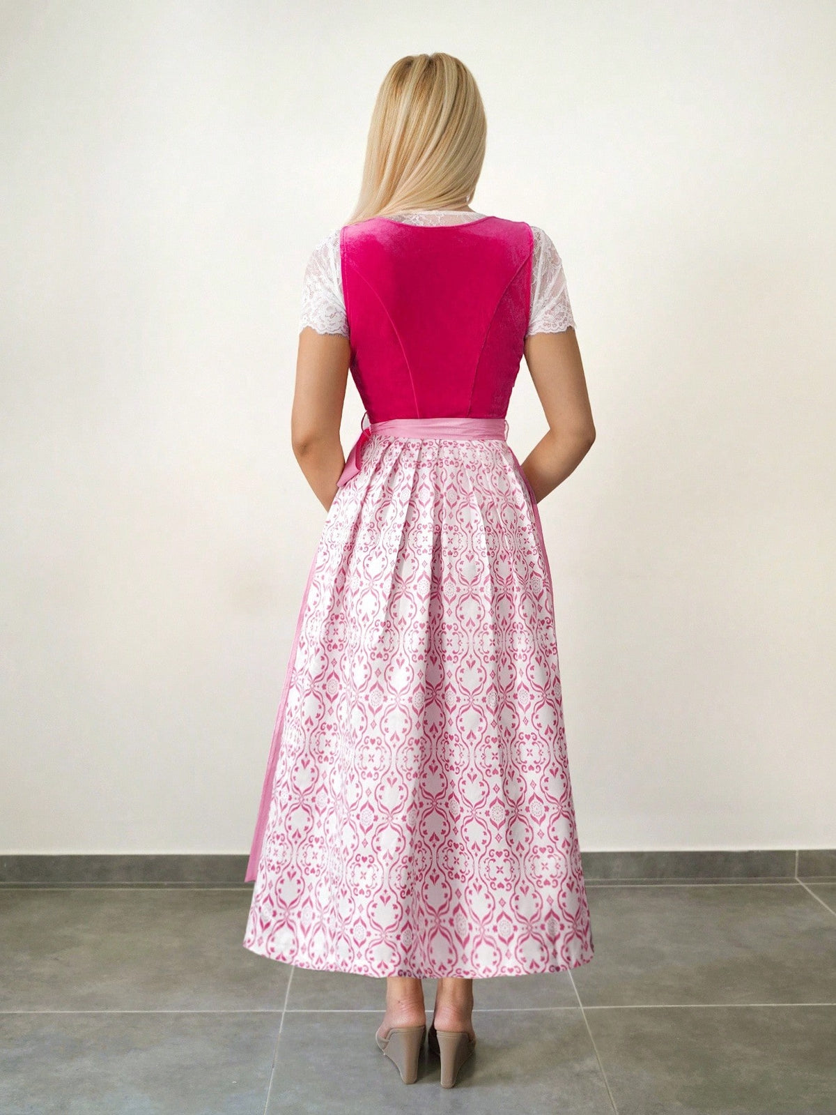 Back view of the dirndl showing the printed skirt and apron ties