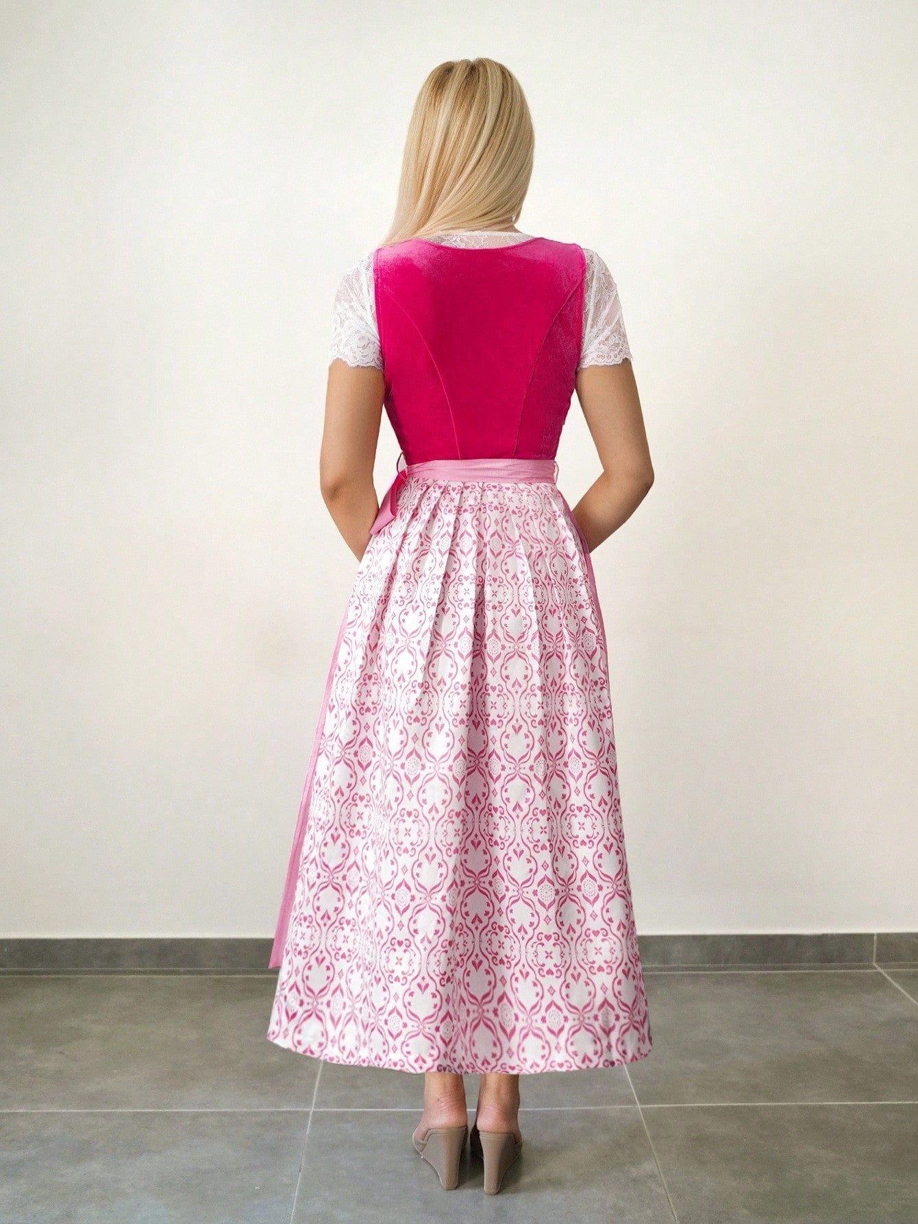 Back view of the dirndl showing the printed skirt and apron ties