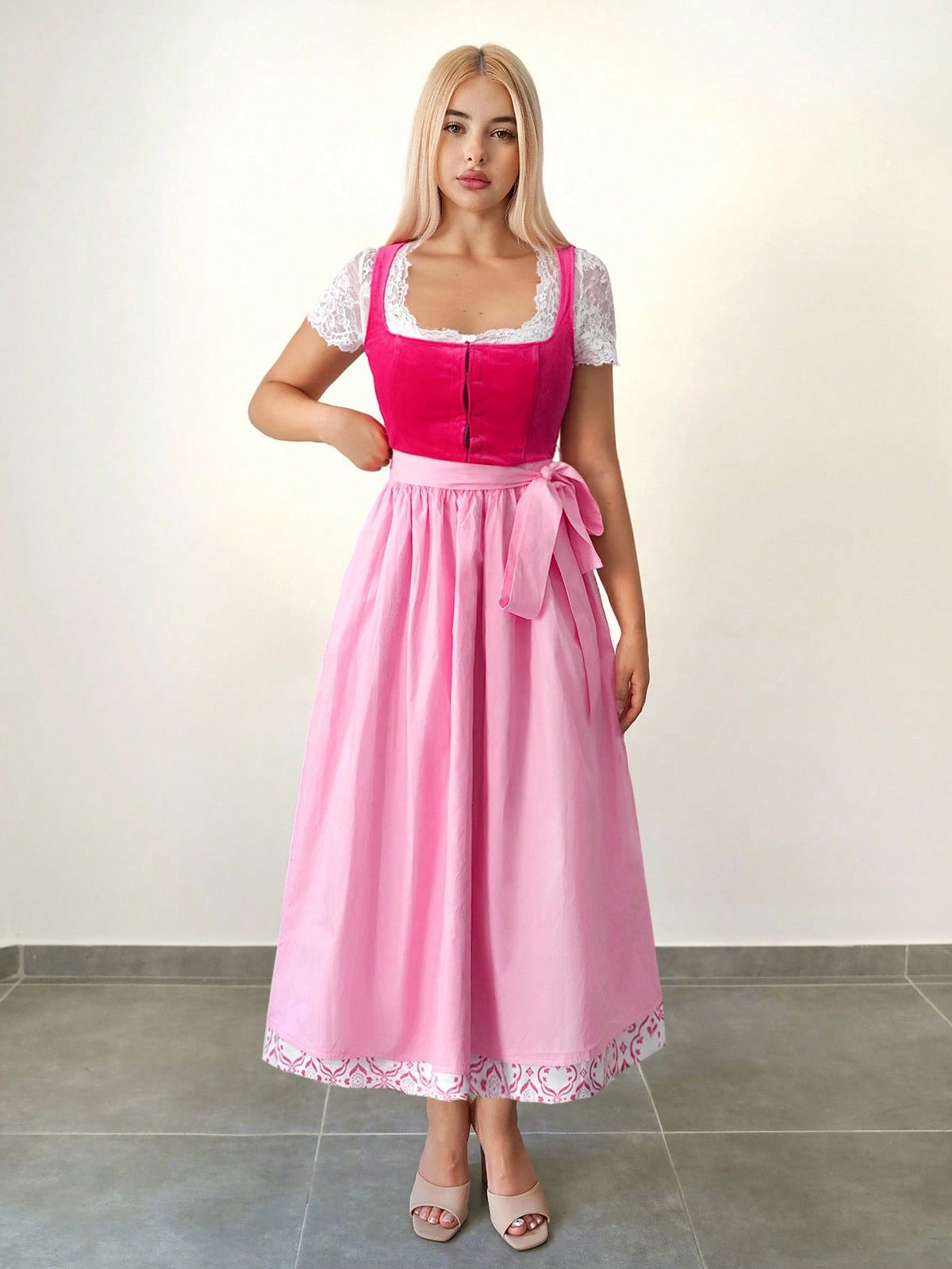 Long dirndl with lace trimmed hem and apron bow