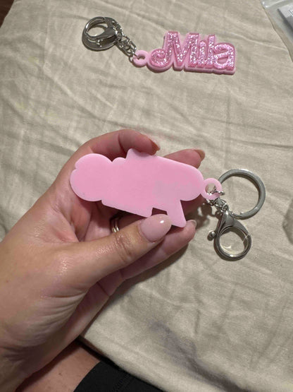 Customer photo - name charm held in hand