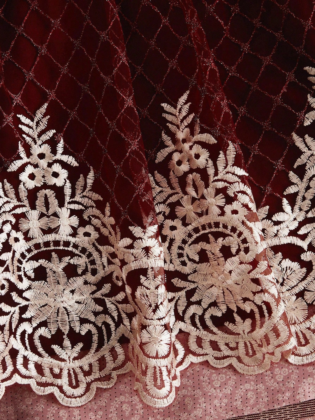 Embroidered lattice hem detail