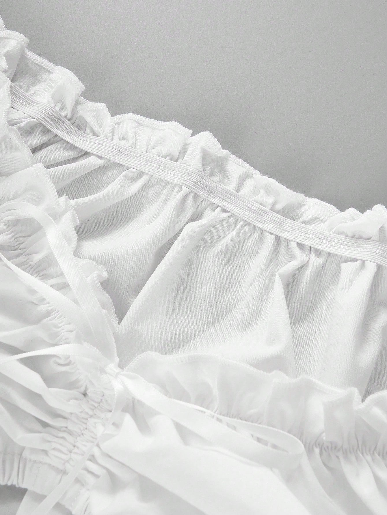 Ruffled neckline and drawstring detail