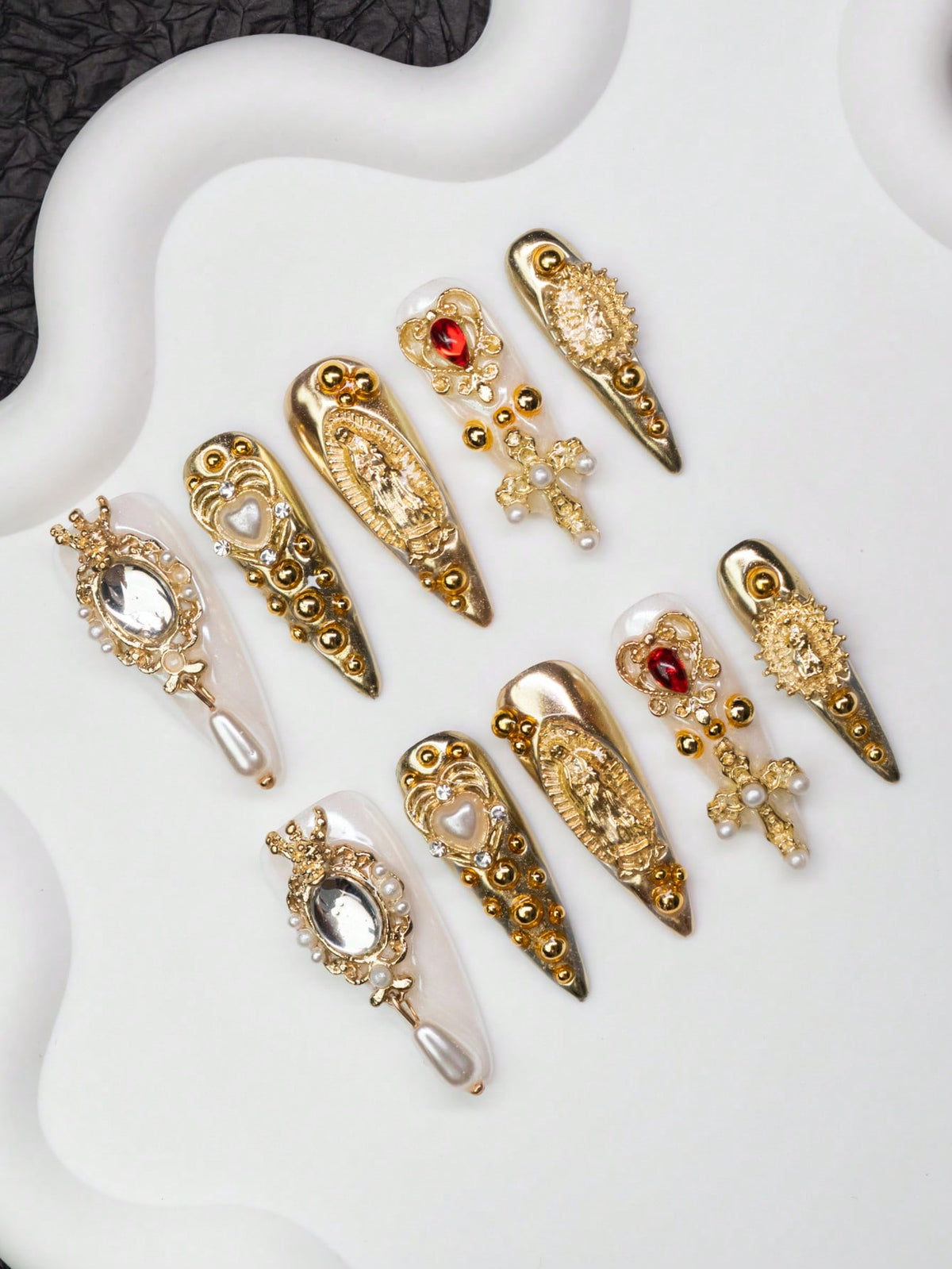 Gold chrome press-on nails, angled view