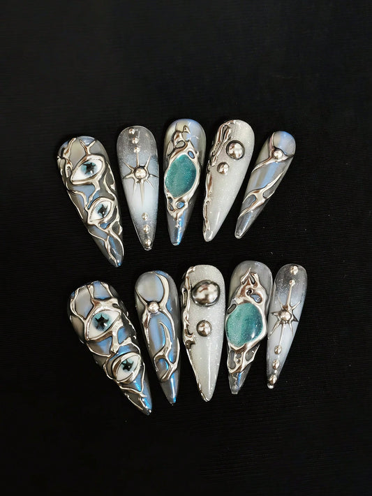 Mercury Gaze long stiletto press on nails in liquid silver chrome with evil eye details