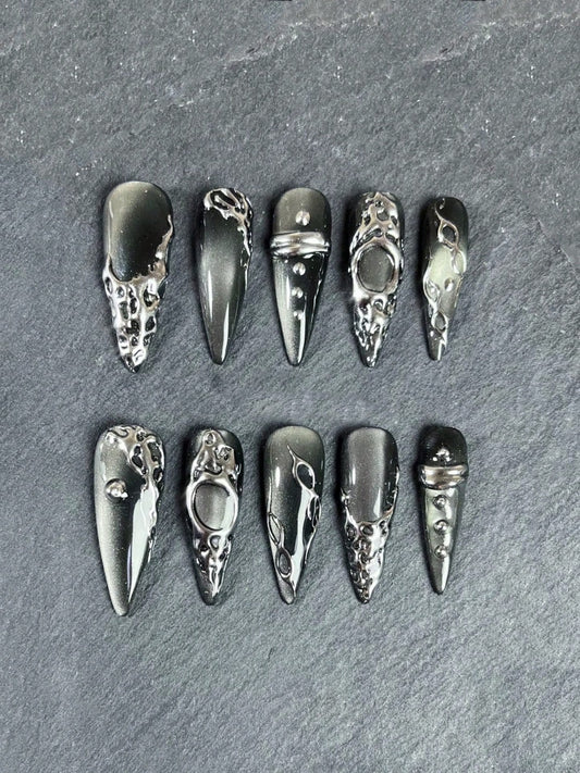 Gunmetal grey cat-eye stiletto press-on nails with liquid silver swirls