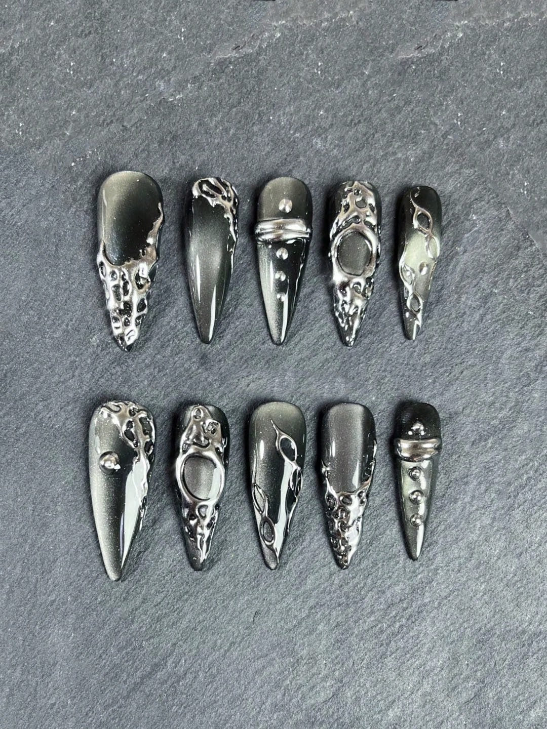 Grey cat-eye stiletto nails detail