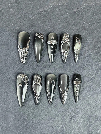 Grey cat-eye stiletto nails detail