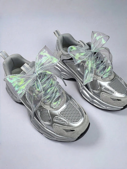 Iridescent ribbon laces on grey and silver trainers