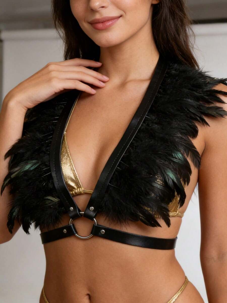 Black feather harness bra top worn over gold bikini