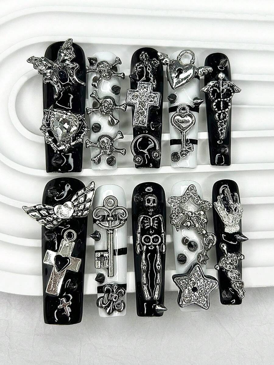 Extra long square press-on nails in gloss black and white with silver cherub and cross charms