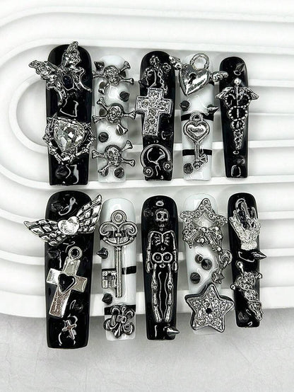 Extra long square press-on nails in gloss black and white with silver cherub and cross charms