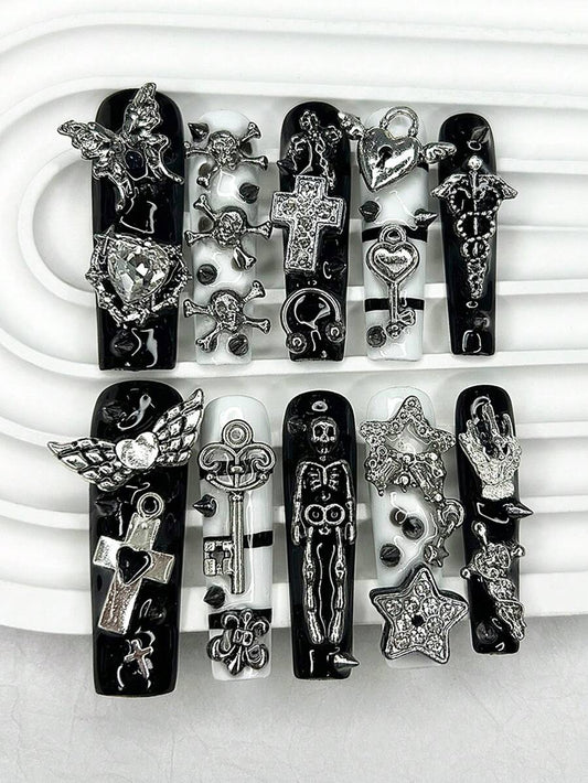 Extra long square press-on nails in gloss black and white with silver cherub and cross charms