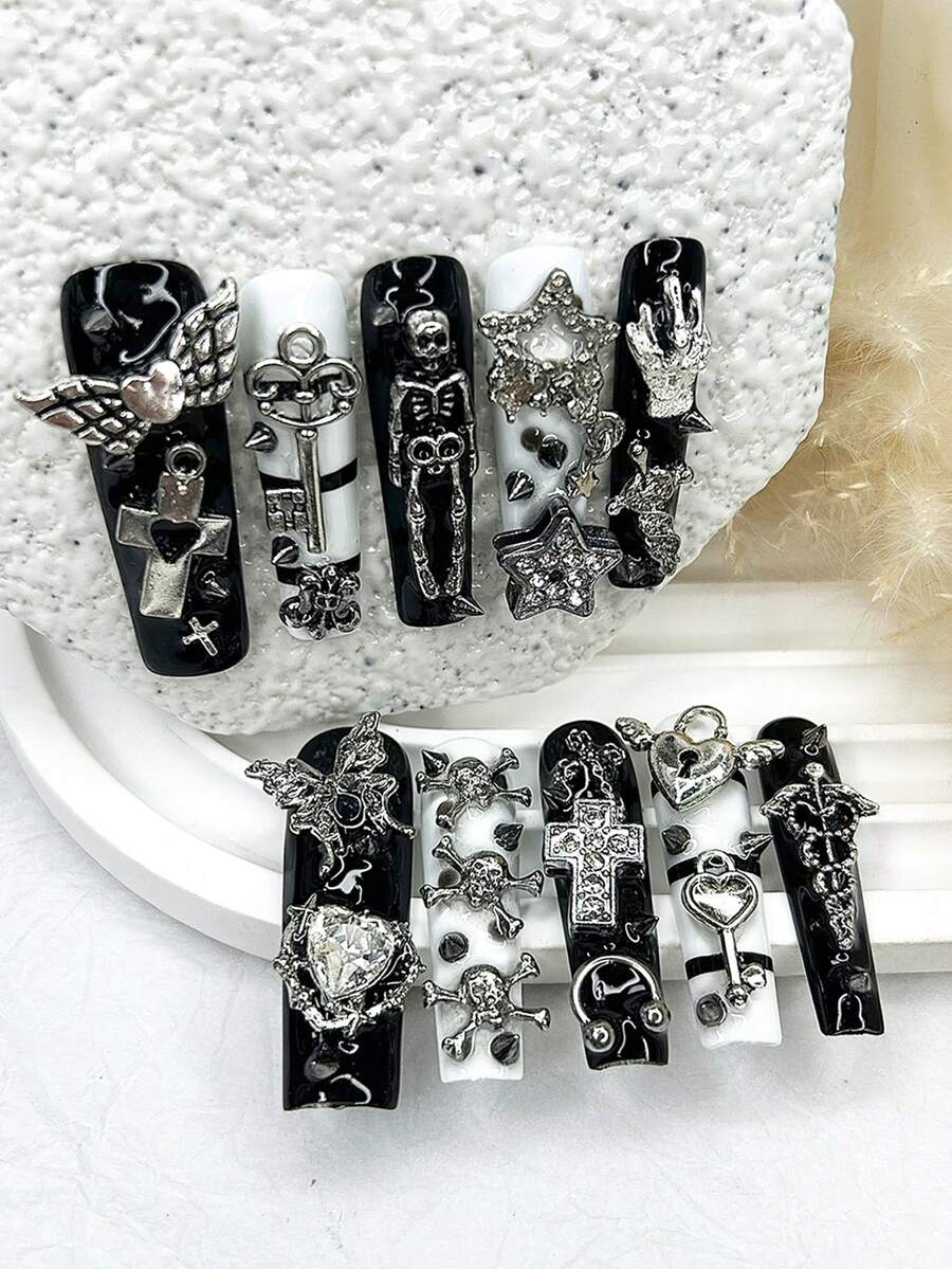 Full ten piece gothic press-on nail set laid out by size