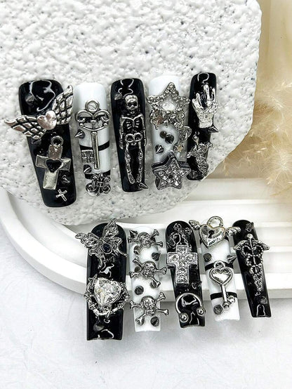 Full ten piece gothic press-on nail set laid out by size