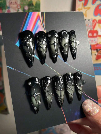 Full ten piece black chrome stiletto press-on nail set