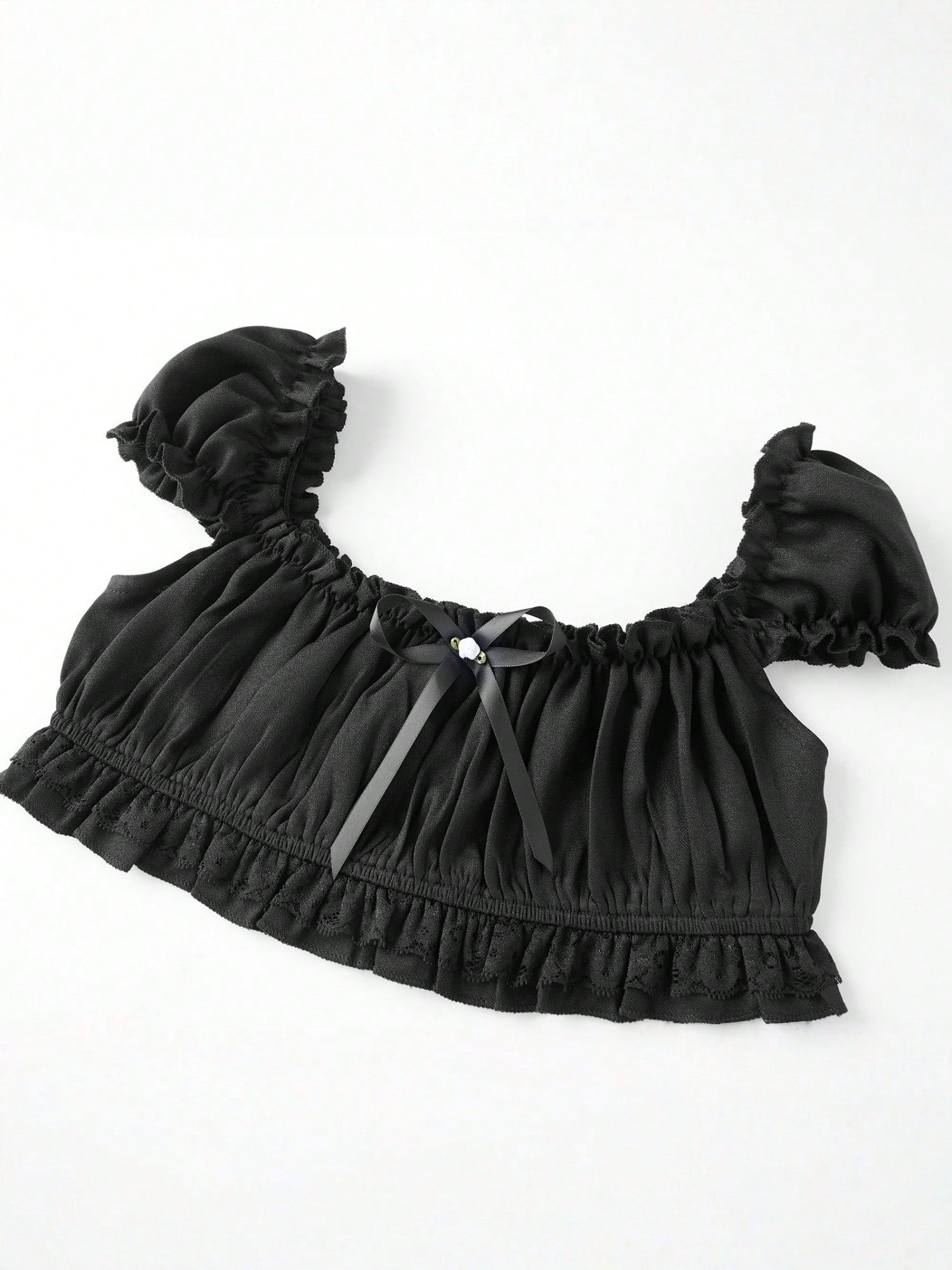 Black Coffee crop top laid flat, angled