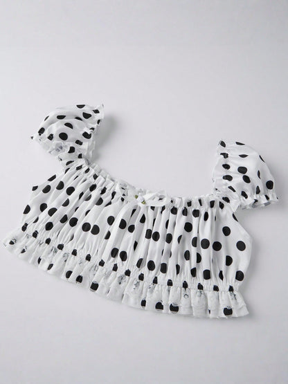 Domino Cream polka dot crop top laid flat, angled