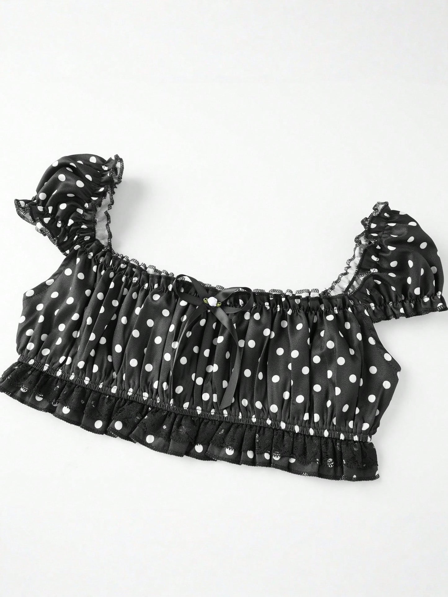 Pin Dot Noir crop top laid flat, angled