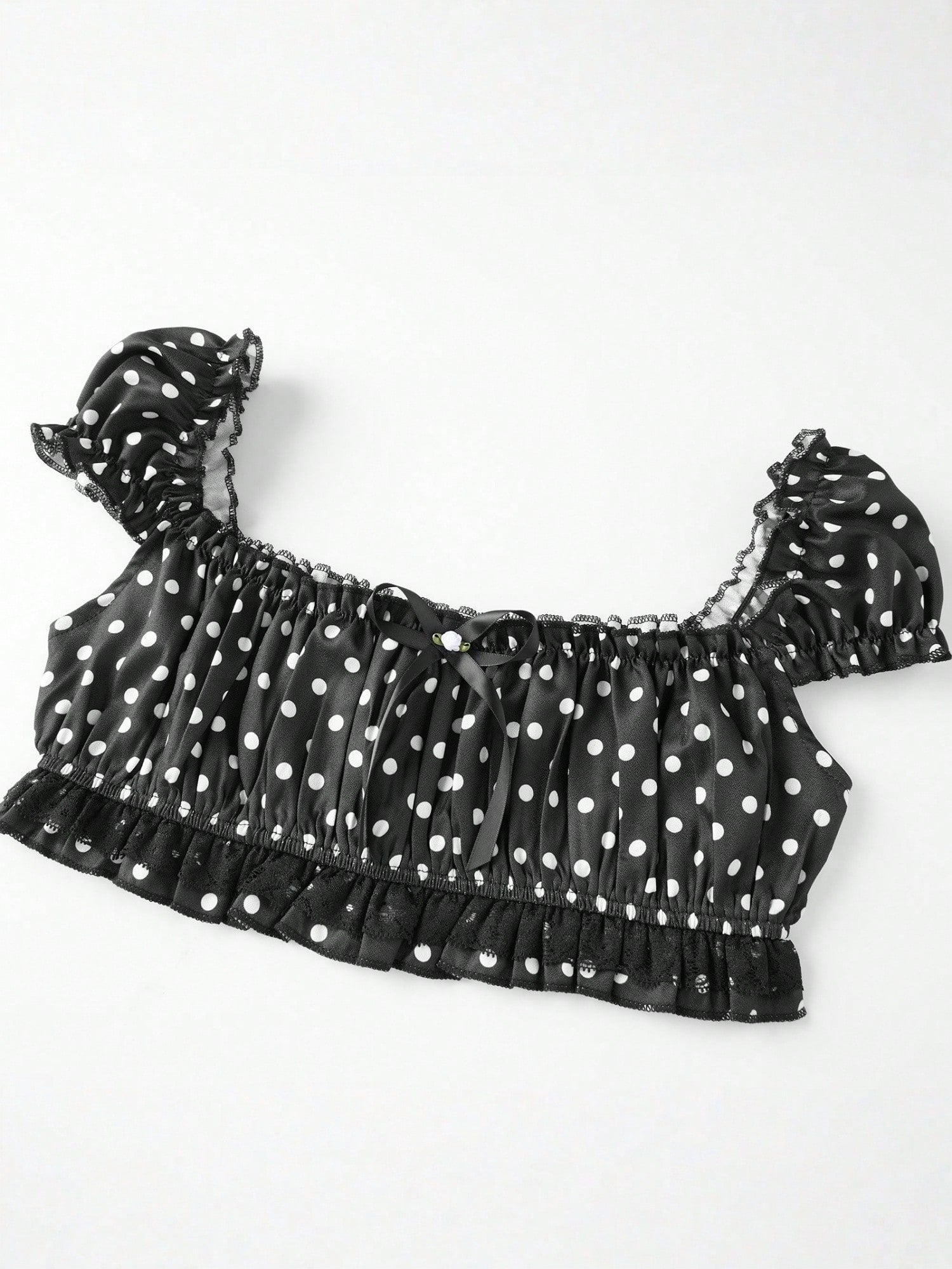 Pin Dot Noir crop top laid flat, angled