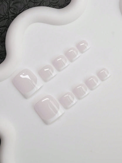 White French press-on toenails, angled view