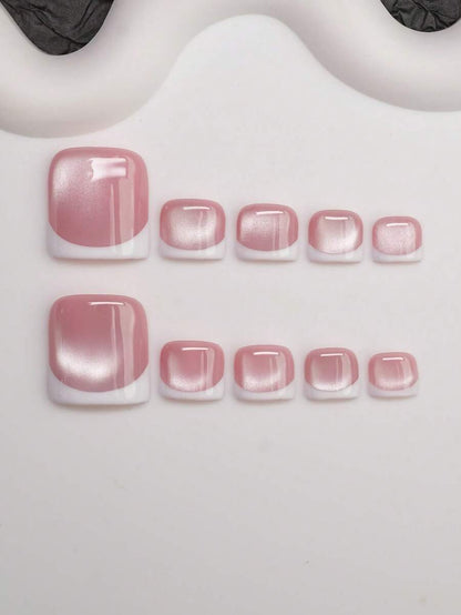 Short soft square press-on nails in rose cat-eye shimmer with a white French edge