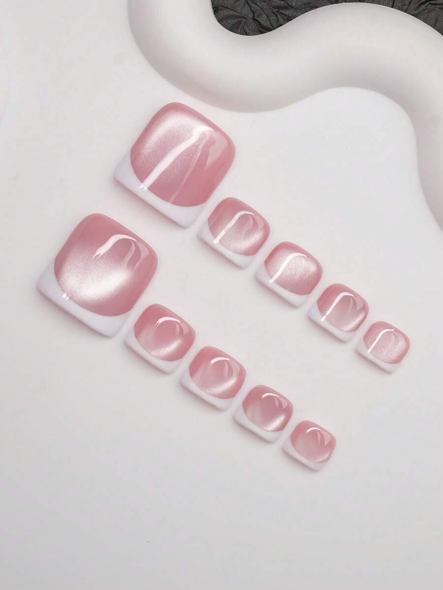 Angled view showing the cat-eye light band across the rose nails