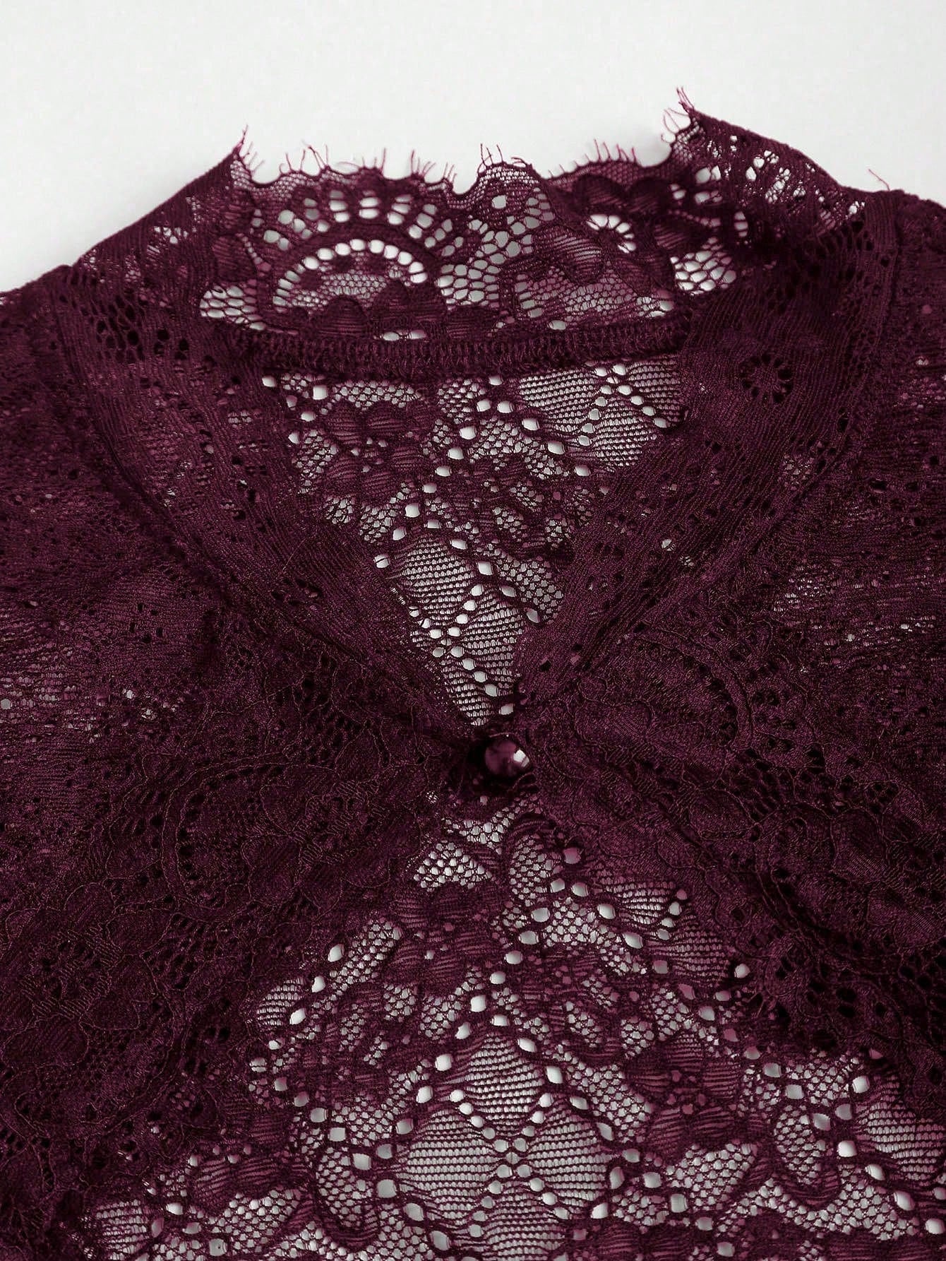 Oxblood stand collar and keyhole detail