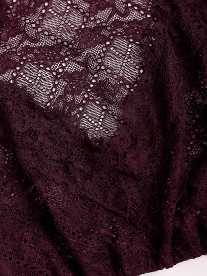 Oxblood baroque lace texture close up