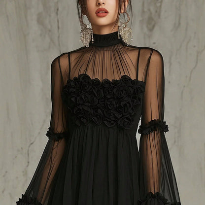 Front view of the black mesh mini dress with ruffled hem