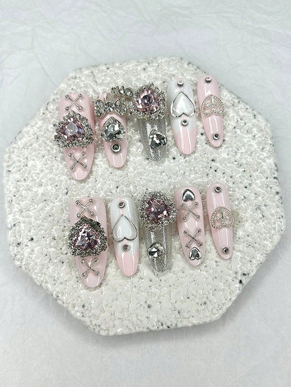 Crystal heart and silver cross-lace oval press-on nails, detail view