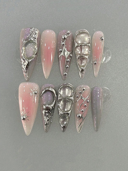 Blush pink and lilac cat-eye long stiletto press-on nails with liquid chrome swirls and silver beads