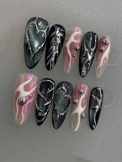 Pink flame and chrome heart almond nails