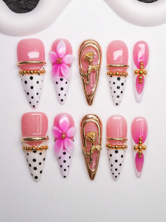 Pink French polka dot long almond press-on nails with 3D flower and gold rose charm
