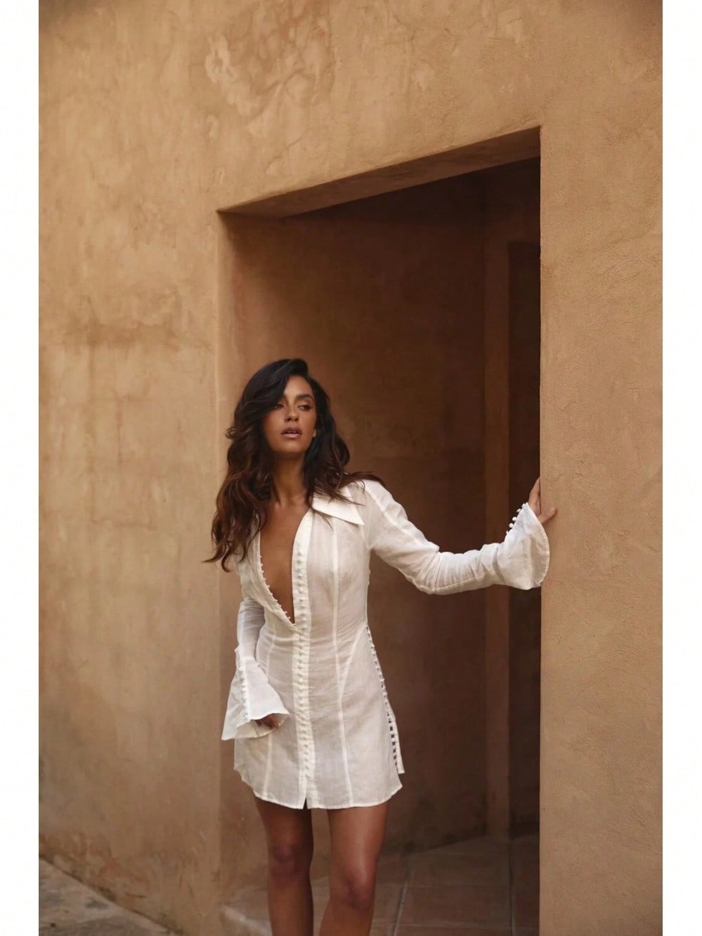 Salt White linen shirt dress full length in a doorway