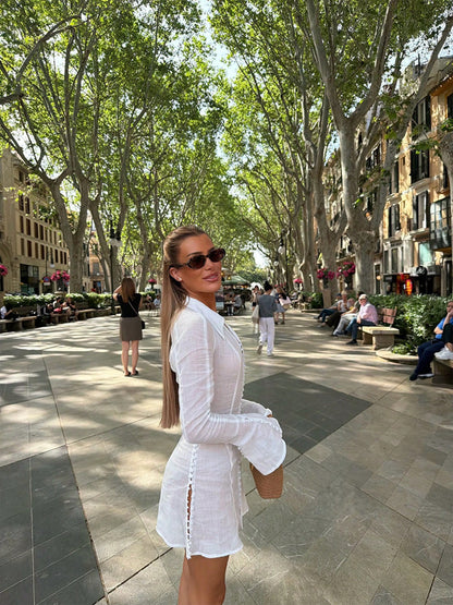 White linen shirt dress worn outdoors under trees